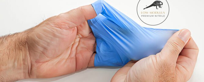 Hands holding low modulus prosenso nitrile glove