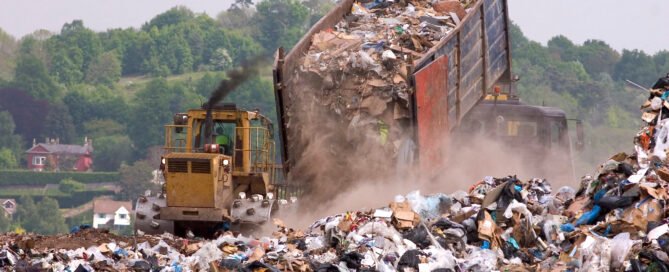 Big truck dropping waste unto landfills
