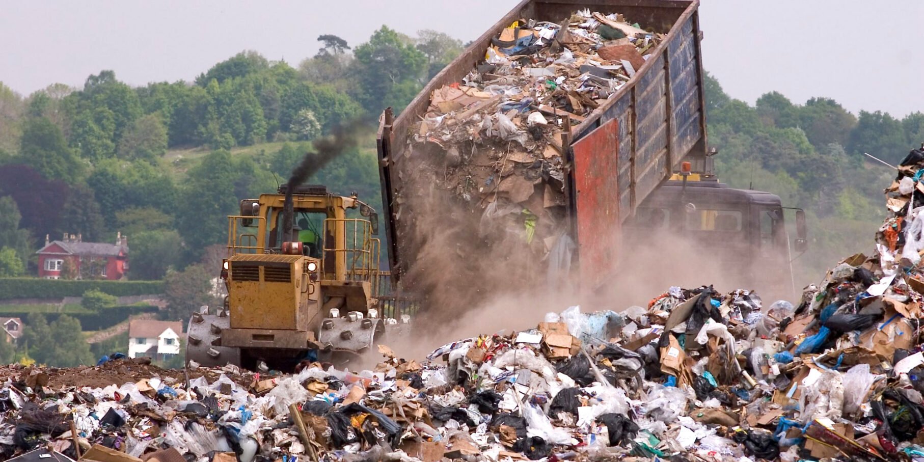 Big truck dropping waste unto landfills