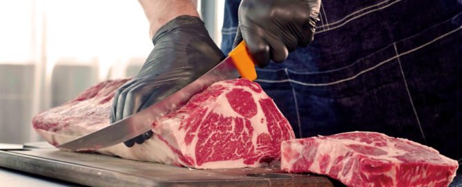 Food safe black prosenso gloves cutting ribeye steak