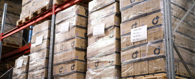 Nitrile gloves on pallets in warehouse rack