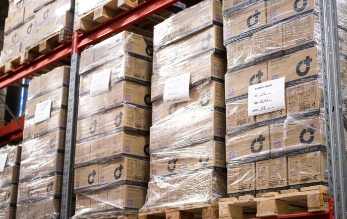 Nitrile gloves on pallets in warehouse rack